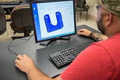 Student works on CAD program in Fort Campbell campus lab