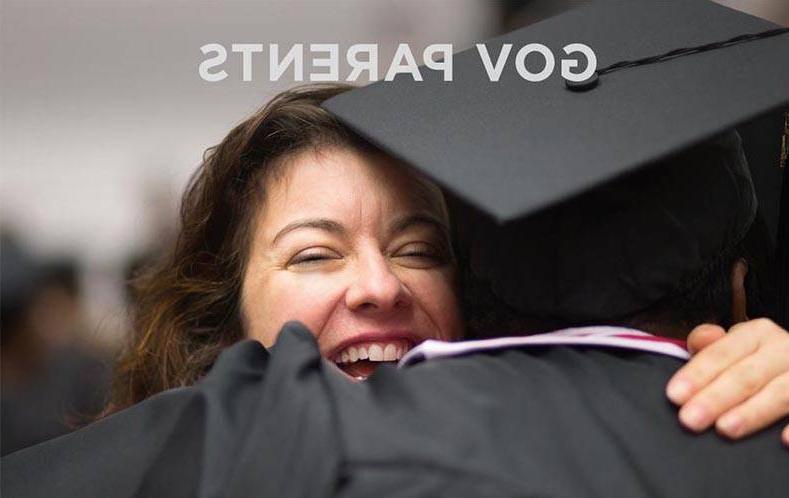 Parent hugging her son at graduation