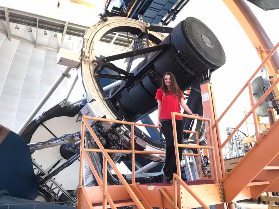Deborah poses with telescope in Chile