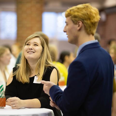 Students talking at a networking event