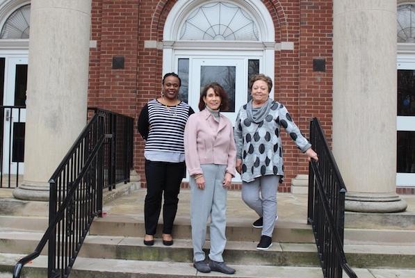 Nursing faculty pose in front of McCord